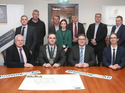 Signing the contract for Ravel Drive, Dunleer. Front row - David Conway CE of Louth Co. Co., Kevin Callan Cathaoirleach of Louth Co. Co., Sean O’Hare of OHMG and Ger Murphy of Director of Services Louth Co. Co. Back row - Brendan McArdle of Louth Co. Co., Declan Grimes of Louth Co. Co., David Fallon, Tiernan McCarthy of EML Architects, Rachel Hamilton of Louth Co. Co., Stephen Collins of COMA Architects, Cathal O’Hare of OHMG, Noel Hamilton of OHMG and Eddie O’Hare of OHMG.